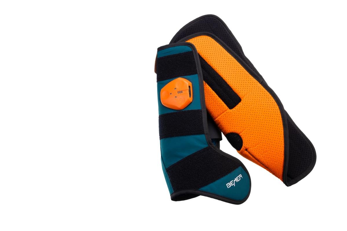 BEMER horse leg cuff in teal and black with an orange lining